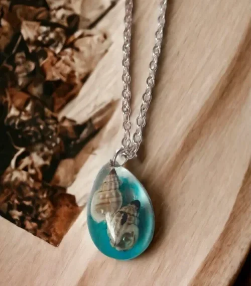 Oceanic Beauty Oval Seashell Necklace #JoyfulGifts #HandmadeExcellence Anniversary Gifts, Artwork, Birthday Gifts for Her, Botanical Jewellery, Botanical Necklace, Eco-Friendly, Gifts for Mother, Gifts for Wife, Gifts for Women, Handcrafted, Handicrafts, Handmade, Jewellery, Marine Jewellery, Marine Necklace, Mother's Day Gift Ideas, Nature Jewellery, Necklace, Online Jewellery Store, Resin Jewellery, Seashell Jewellery, Seashell Necklace, Valentine's Day Gift