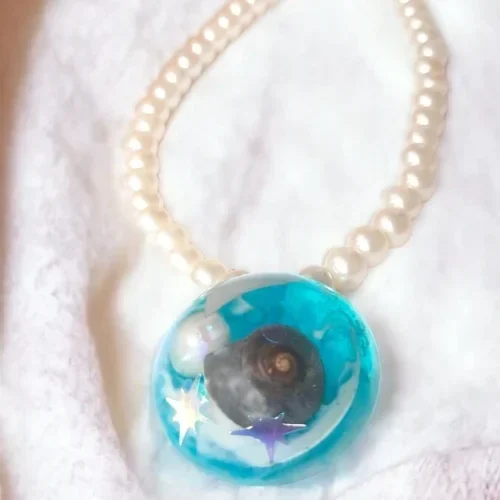 Aqua Charms Captivating Round Seashell Necklace #SeashellElegance #HandmadeExcellence Anniversary Gifts, Artwork, Birthday Gifts for Her, Botanical Jewellery, Botanical Necklace, Eco-Friendly, Gifts for Mother, Gifts for Wife, Gifts for Women, Handcrafted, Handicrafts, Handmade, Jewellery, Marine Jewellery, Marine Necklace, Mother's Day Gift Ideas, Nature Jewellery, Necklace, Online Jewellery Store, Resin Jewellery, Seashell Jewellery, Seashell Necklace, Valentine's Day Gift